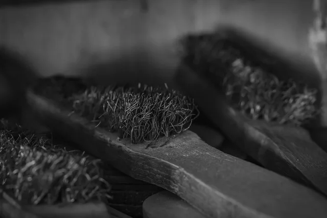 steel brushes, tool, used up steel brushes, decrepit steel brushes, black and white, gray tools. Used chimney sweep equipment: working out the cost per year